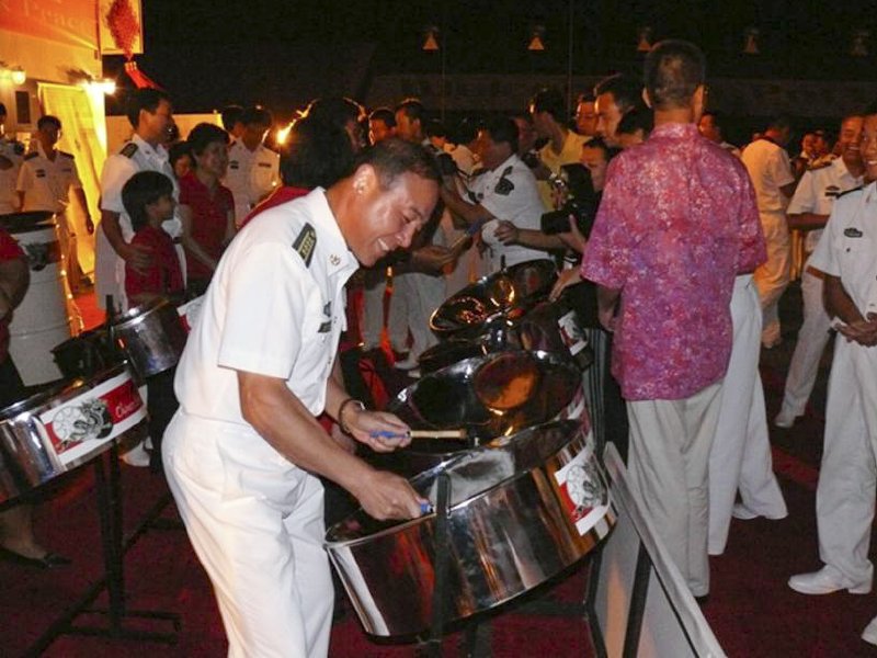 Chinese naval officer trying his hand on the tenor pan