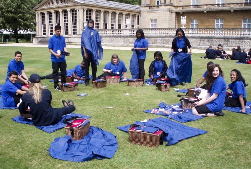 SV2G’s Wycombe Steel Orchestra musicians, each with picnic hamper before their performance in Buckingham Palace’s back garden