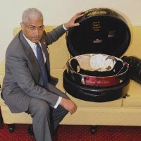 T&Ts High Commissioner to London Garvin Nicholas poses with a tenor pan, one of the gifts to be presented to the Royal couple Prince William and Kate Middleton who will be married at Westminster Abbey tomorrow