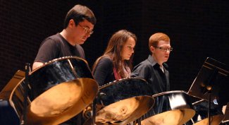 Soloists Luci Chaplin, Alexander Gaffney and Ryan Royle take center stage during the UConn Steel Pan Ensemble concert at von der Mehden on Sunday. The student music group played a wide range of music, and invited non-percussion instrumentalists to join them as well