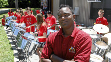 Salmon Cupid, TASSO musical director with a group students - members of The Toronto All Stars Steel Orchestra
