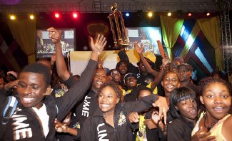 Members of LIME Hells Gate Steel Orchestra celebrate with their trophy after being declared the 2011 Panorama champions