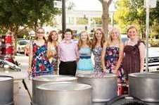 Members of the Oakdale Junior High School Steelband pose in front of their steel pans in downtown Modesto where they became finalists in the Gallo Center for the Arts Valleys Got Talent 2013 competition. In random order, members are Hailey Brown, Liz White, Lacie Blount, Sophie Jones, Jenni Shaefle, Sarah Hammoudi, and Ryan Hodge. Not pictured: Meghan Caron and music director Ross McGinnis.